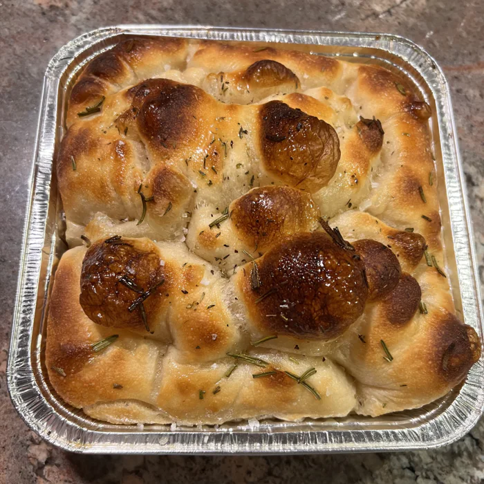 Rosemary focaccia, pull-apart rounds baked golden in a pan